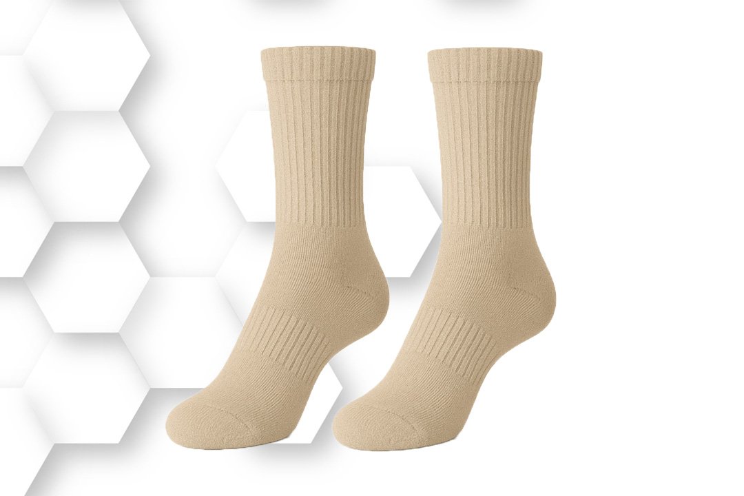 Beige crew socks made from soft cotton-blend fabric with ribbed cuffs, designed for comfort, breathability, and everyday wear.
